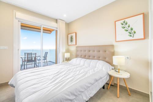 Кровать или кровати в номере Playa Principe Esc 10
