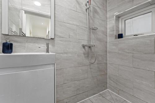 a bathroom with a shower and a sink at Gorgeous 3-bedroom in London - Sleeps 8 in London