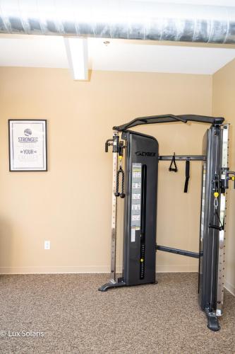 a gym with a large machine in a room at Luxury 3 Bedrooms with King bed Downtown Indy in Indianapolis