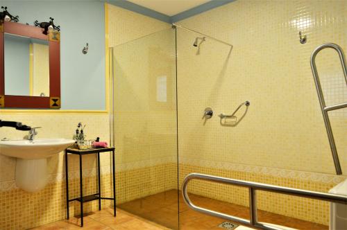 a bathroom with a shower and a sink at Hotel Rural Alfajía de Antonio in Capileira