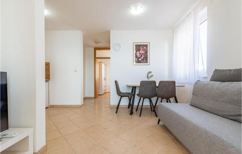 a living room with a couch and a table at Vila Sidro in Košljun