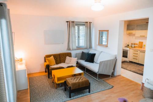 a living room with a couch and a table at Cottage in Domasa 2 