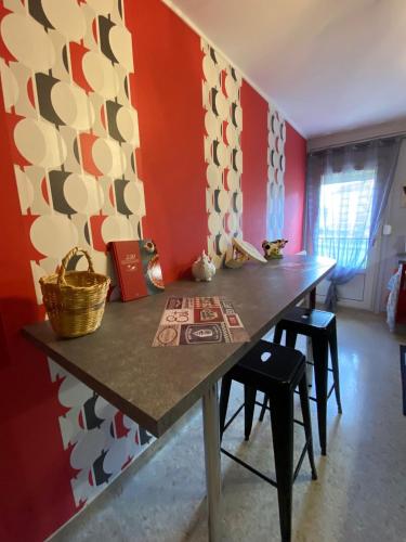 a dining room with a table and chairs at CHEZ NOUS BIS in Commercy