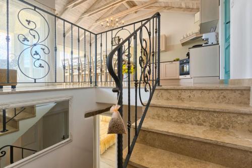 a staircase with a wrought iron gate in a house at Villa Lapis in Buzet
