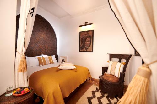 En eller flere senger på et rom på Riad Dar Amanza en exclusivité avec 4 chambres au coeur de la médina