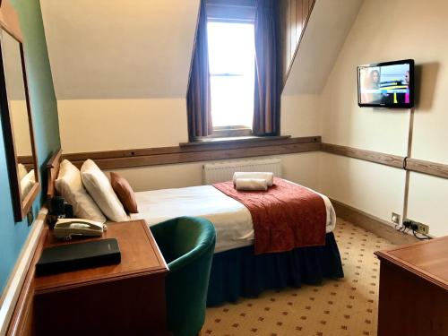 Ένα ή περισσότερα κρεβάτια σε δωμάτιο στο Purbeck House Hotel & Louisa Lodge