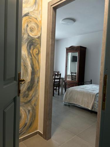 Ένα ή περισσότερα κρεβάτια σε δωμάτιο στο L'INCANTO CASA VACANZE