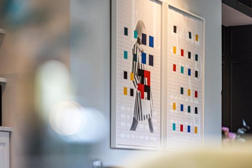 a picture of a painting on a wall at Maison ELLE Amsterdam in Amsterdam