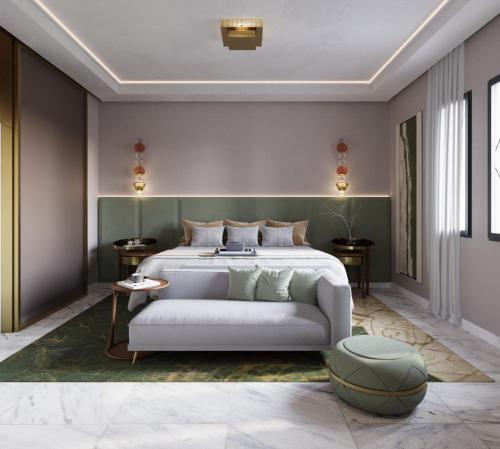 1 dormitorio con cama blanca y cabecero verde en Four Seasons Hotel Rabat at Kasr Al Bahr en Rabat