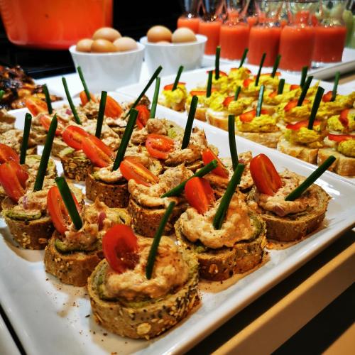 a tray of appetizers on a buffet table at Hill Valley Asilah - Luxury Living & Boutique Hotel in Asilah