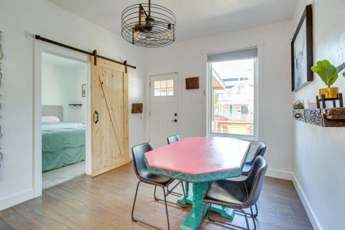 a dining room with a table and chairs and a bedroom at Cozy and Pet-Friendly Home - 3 Mi to Downtown Denver in Denver