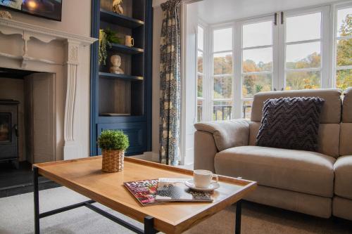 a living room with a couch and a coffee table at Number Six in Ironbridge