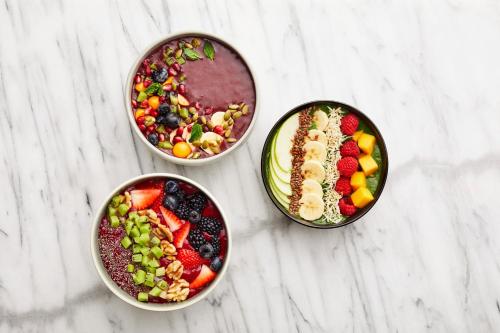 three bowls filled with different types of fruits and vegetables at Sheraton Myrtle Beach in Myrtle Beach