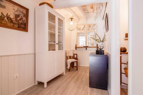 a room with a refrigerator and a table in it at Albergue do Infante in Tomar