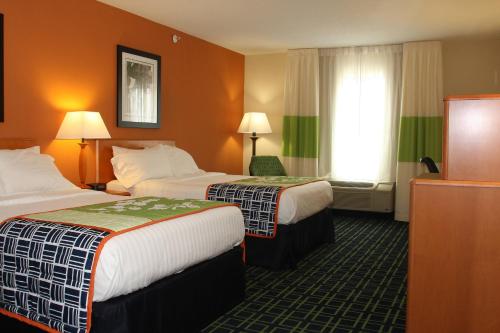 a hotel room with two beds and a window at Fairfield Inn and Suites by Marriott Marion in Marion