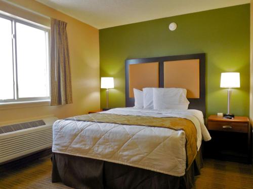 a hotel room with a large bed and a window at Extended Stay America Suites - Austin - Northwest - Research Park in Austin