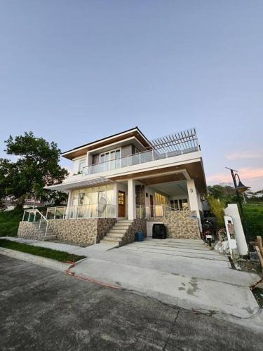 a large house with a driveway in front of it at Villa Pacifica in Nasugbu