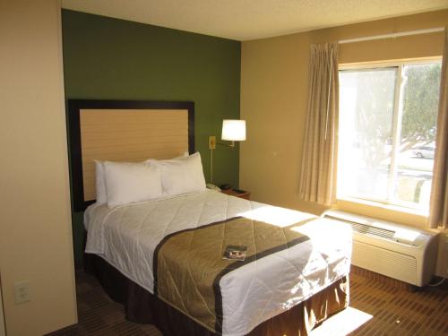 a bedroom with a large bed and a window at Extended Stay America Suites - Austin - Round Rock - North in Round Rock