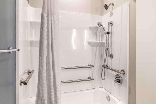 a bathroom with a shower with a shower curtain at Extended Stay America Suites - Colonial Heights - Fort Lee in Colonial Heights