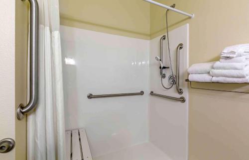 a bathroom with a shower with a shower curtain at Extended Stay Americas Suites - Minot in Minot