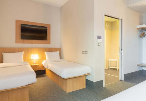 Postel nebo postele na pokoji v ubytování B&B HOTEL Limoges Centre Gare