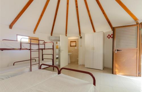 Postel nebo postele na pokoji v ubytování Mattinata Camping