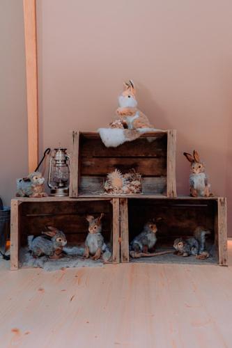 a group of stuffed animals sitting on a shelf at Altipik - Lodges Insolites in Mont-Saxonnex