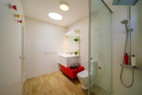 a bathroom with a toilet and a glass shower at Villa Tisalaya by Villa Plus in Puerto del Carmen