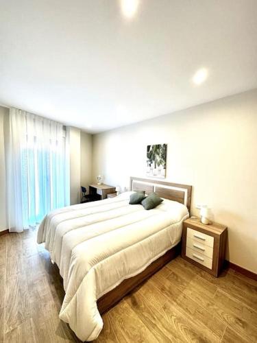Ένα ή περισσότερα κρεβάτια σε δωμάτιο στο Apartamento La Muralla 2D