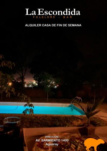 a picture of a swimming pool at night at Punta Cocos 