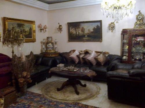 a living room with a couch and a table at Laraqui hossini in Fez