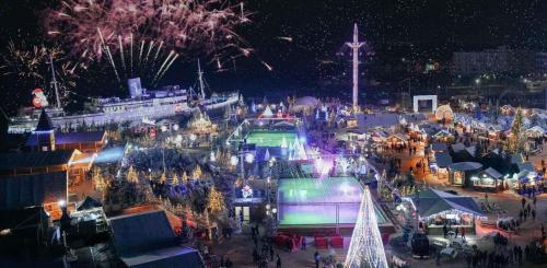a christmas market with fireworks in a city at night at Villa Cara, 6 personnes, proche plage et commerces, secteur calme, Classé 3 étoiles in Le Barcarès