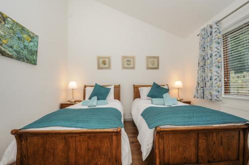 מיטה או מיטות בחדר ב-Lambley View