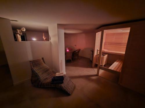 a small room with two chairs and a bed at Ferienwohnungen Das Finkhaus in Simonsberg