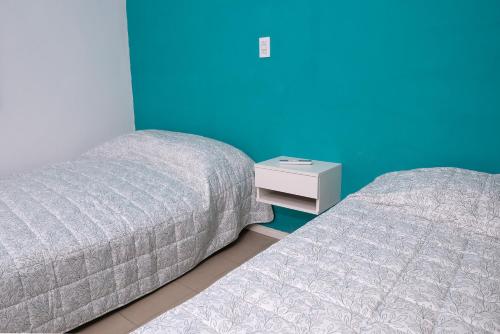 En eller flere senge i et værelse på Alta Pinta