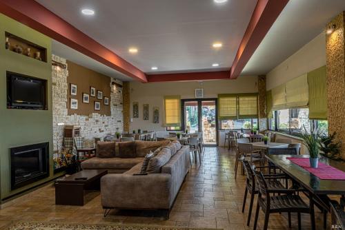 a living room with a couch and a fireplace at Castella Beach in Alissos
