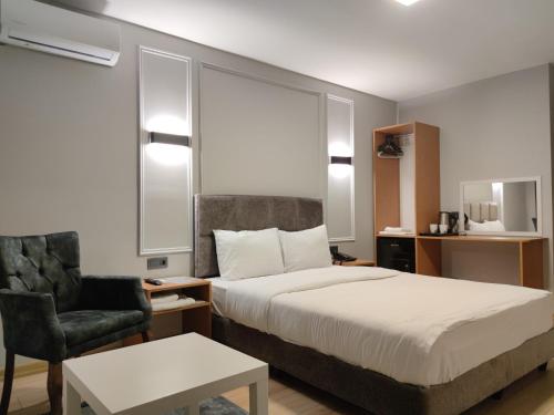 Katil atau katil-katil dalam bilik di Olen Uskudar Hotel