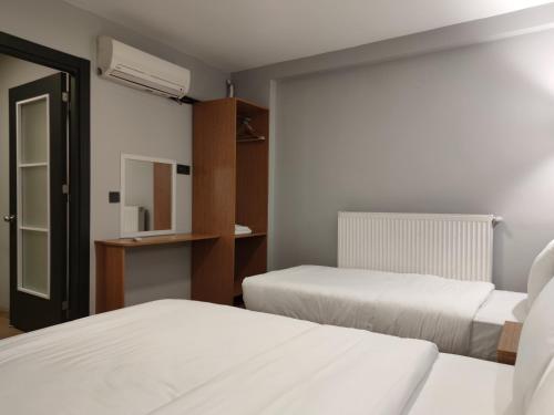Katil atau katil-katil dalam bilik di Olen Uskudar Hotel