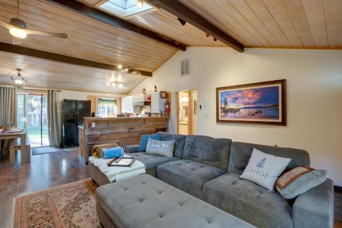 a living room with a couch and a table at 3 Mi to Heavenly Mountain Resort Home with Deck in Stateline
