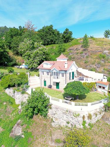 an aerial view of a house on a hill at Casa dos Plátanos near the center of Amarante, Golf Course and Water Park. in Amarante