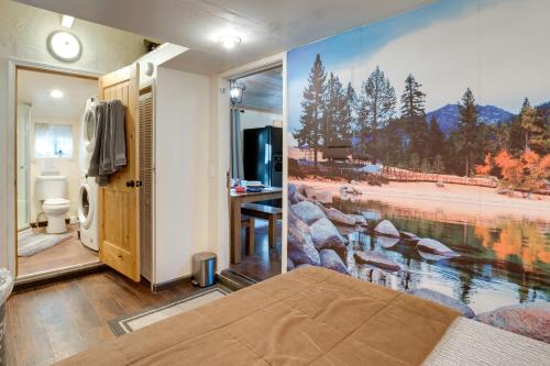 a bedroom with a large painting on the wall at Stateline Home about 2 Mi to Tahoe Beaches in Stateline