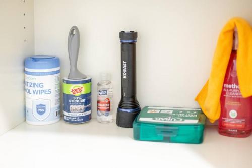 a shelf with a toothbrush and other items on it at King & Queen First Floor Unit! 1-2c Georgetown Villas in Fairview Park
