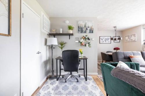 a living room with a couch and a table at King & Queen First Floor Unit! 1-2c Georgetown Villas in Fairview Park