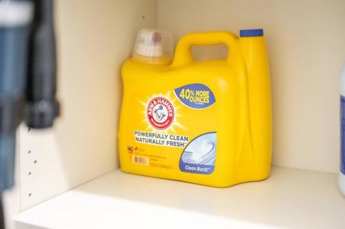 a yellow detergent container is sitting on a shelf at King & Queen First Floor Unit! 1-2c Georgetown Villas in Fairview Park