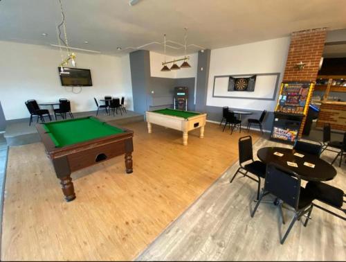 a room with a pool table and ping pong ball at H9 Fairway Holiday Park Sandown in Sandown