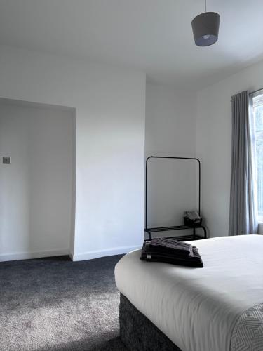 Katil atau katil-katil dalam bilik di Cosy Home in Manchester