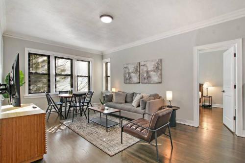 a living room with a couch and a table at Comfortable 2BR Chicago Apt - Sunnyside 2F in Chicago
