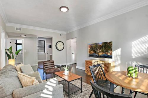 a living room with a couch and a table at Comfortable 2BR Chicago Apt - Sunnyside 2F in Chicago