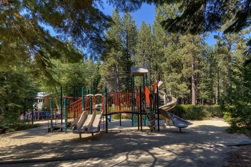 a playground with a slide in a park at New Listing! Woodland Heights at Tahoe Park- Pet Friendly - Private Beach in Tahoe City