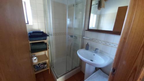 a bathroom with a shower and a sink at Monte Gaia in Cavaleiro